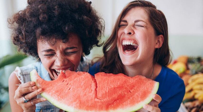 Girls eat watermelons