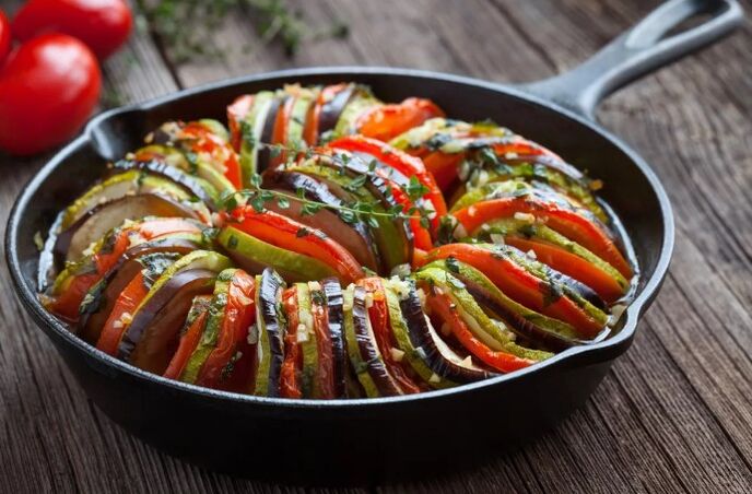 Garnish with tomatoes and pumpkin